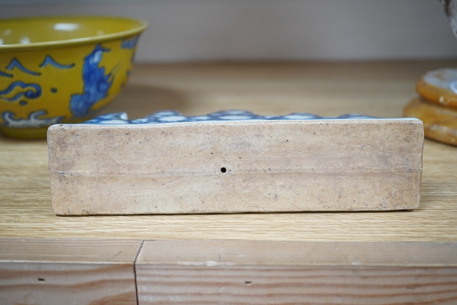 A Chinese blue and white brush holder and a yellow ground bowl, 16cm diameter, Condition - good